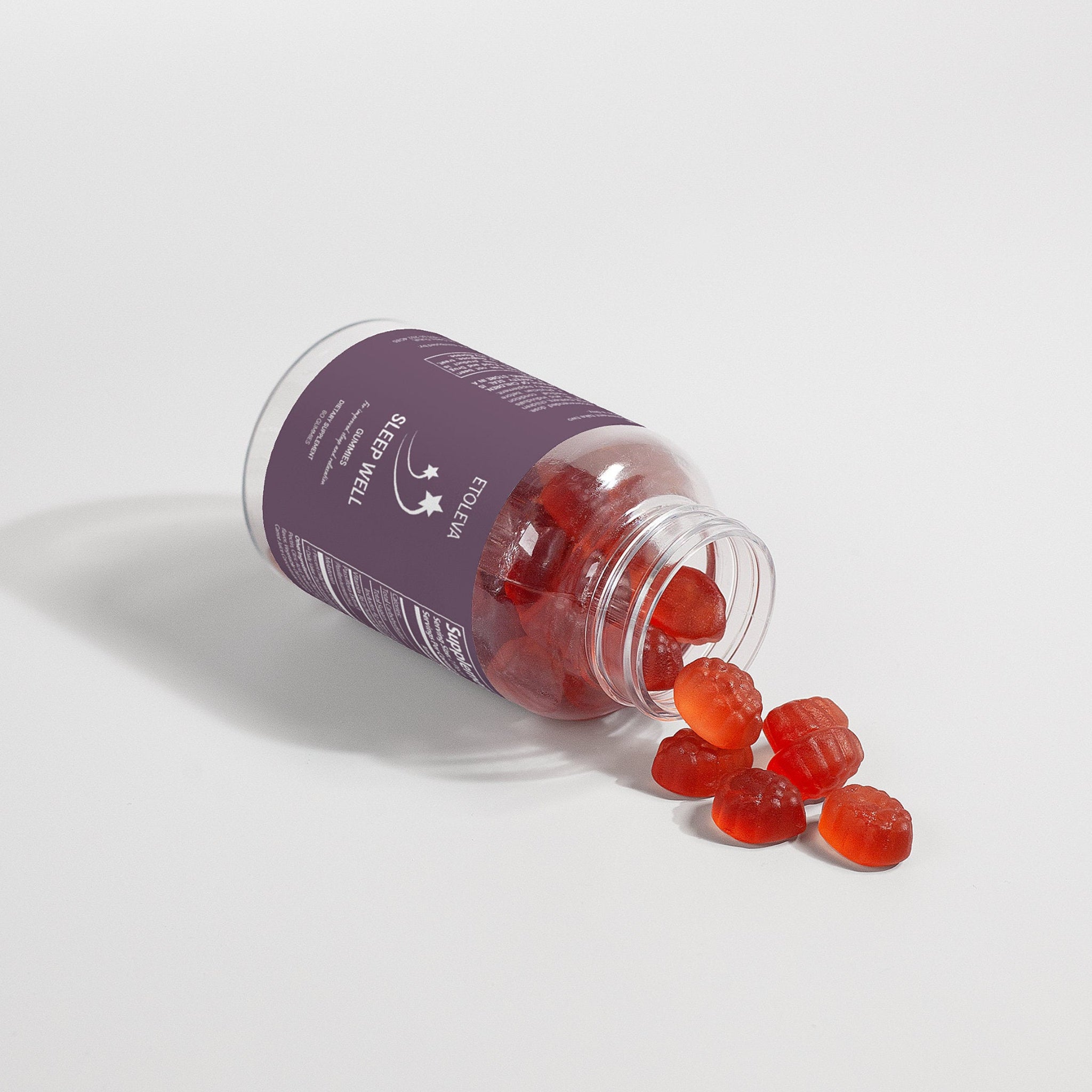 Étoleva Sleep Well vegan melatonin sleep aid gummies spilling out of bottle